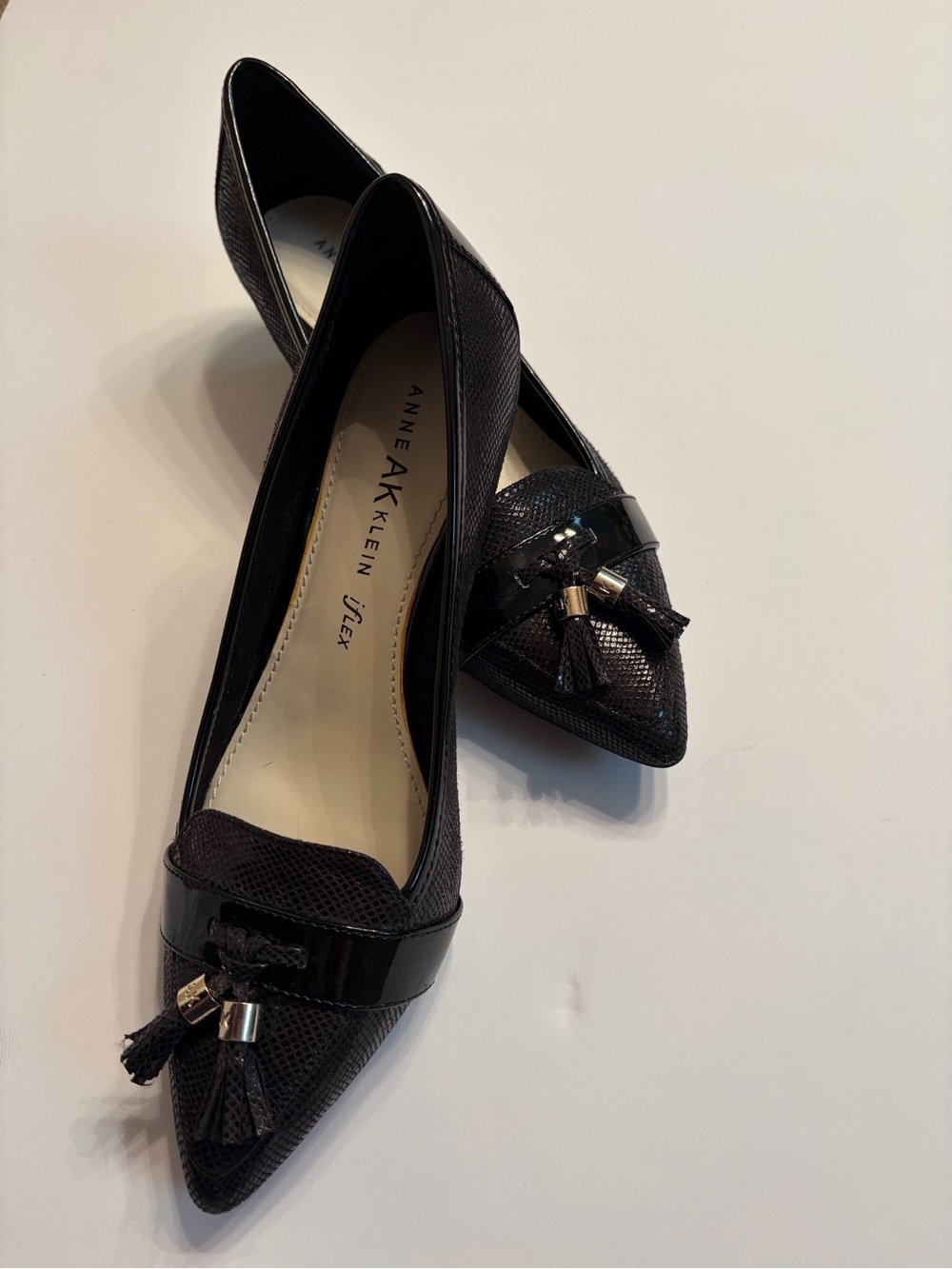 Anne Klein I-flex Black kitten heels with pointed toe and tassel.